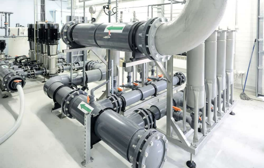 industrial boiler room with pipes valves and equipment