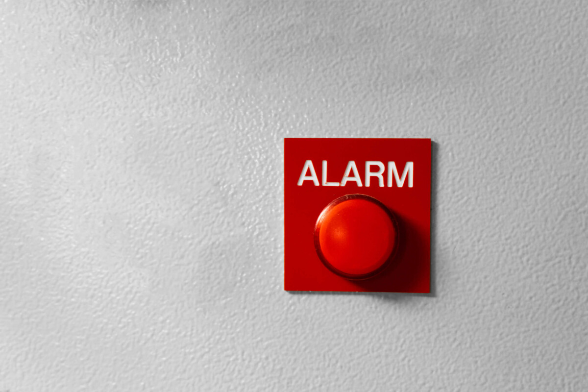 red alarm stop button on wall